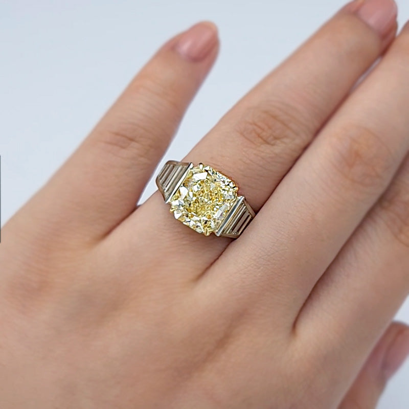 Fancy Yellow Radiant Cut Diamond in Art Deco Style Engagement Ring setting on wedding finger