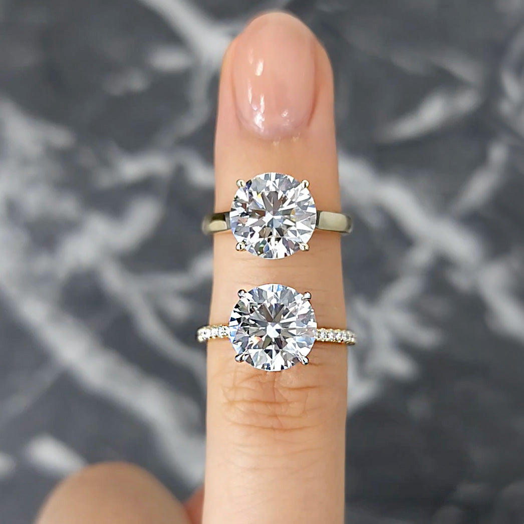 Round Brilliant Cut Diamond Engagement Rings on finger