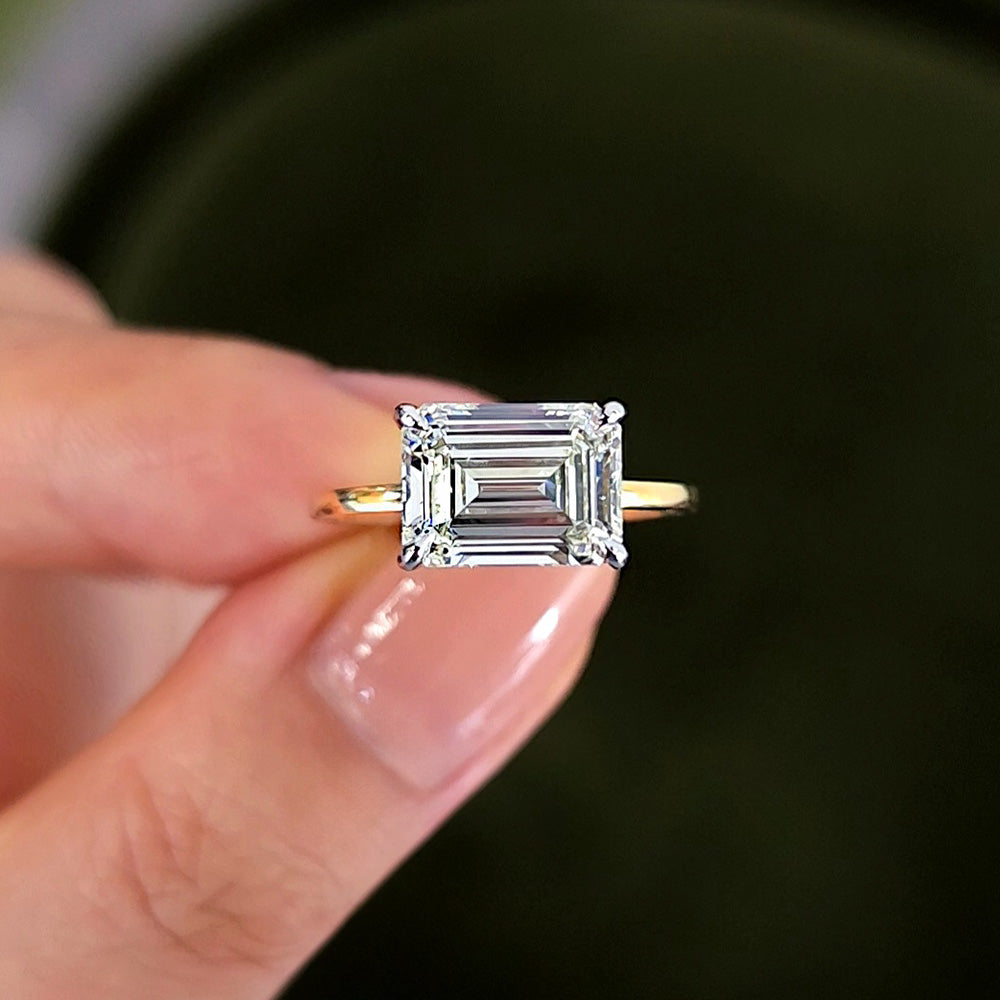 East West Emerald Cut Diamond Engagement Ring on a Yellow Gold Solitaire Setting