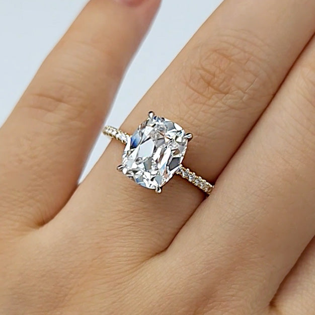 Elongated Old Mine Cut Diamond on a Pave Setting on wedding finger