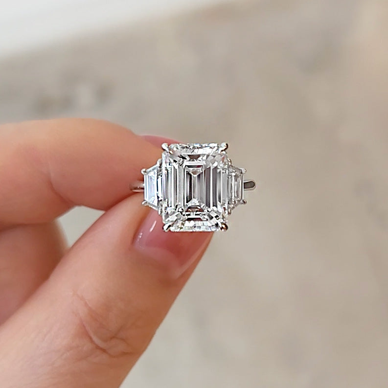 Emerald Cut Three Stone Diamond Ring With Trapezoid Side Stones