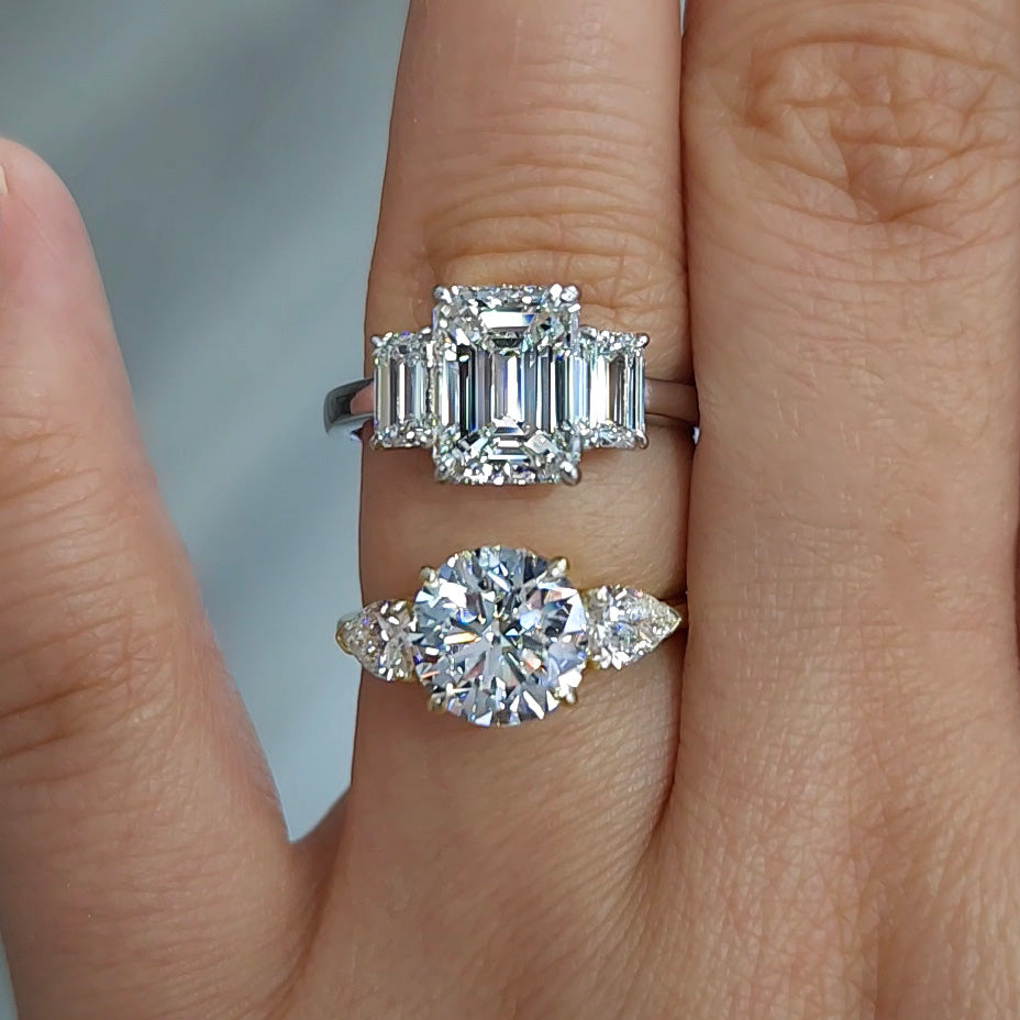 Emerald Cut and Round Cut Three Stone Engagement Rings