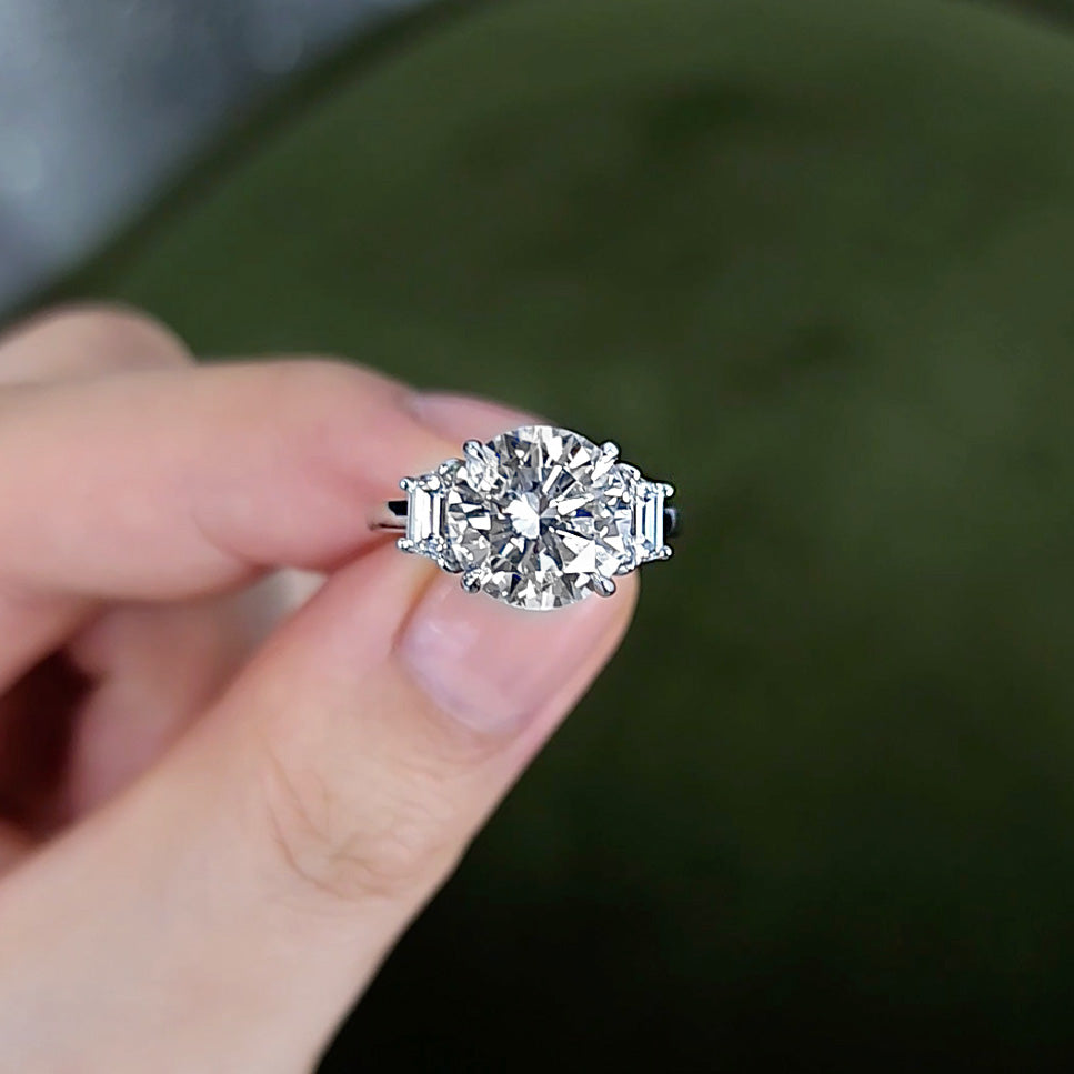 Round Brilliant Cut Three Stone Diamond Ring with Trap Side Stones