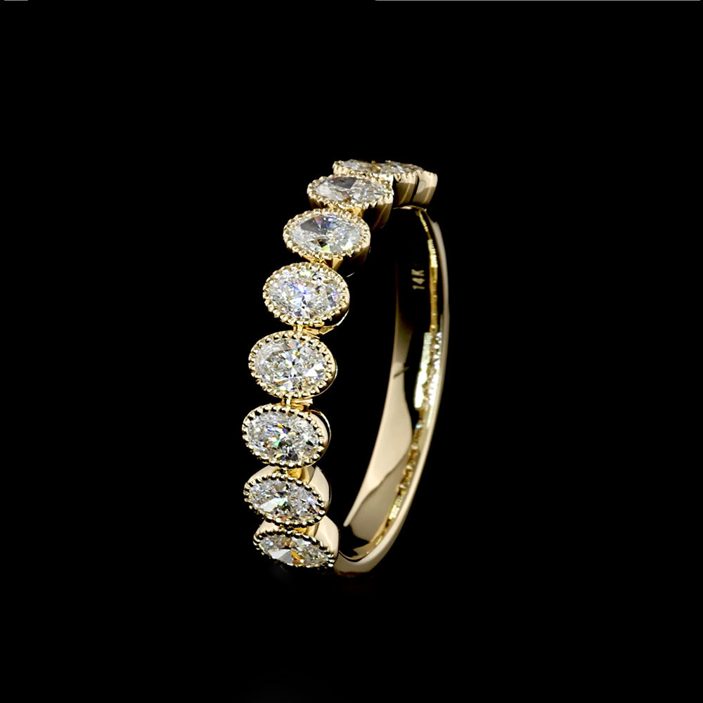 9 Oval diamonds set on 14k yellow gold ring