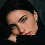 Model wearing Colombian Emerald and Asscher Cut Lab Diamond Earrings