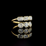 Emerald and Round Diamond Bypass Bezel Ring