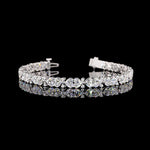Lab Grown Heart cut diamond tennis bracelet.

12cts total weight, 68 diamonds

E/F VVS-VS1

6.5" long

14K White Gold