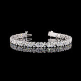 Lab Grown Heart cut diamond tennis bracelet.

12cts total weight, 68 diamonds

E/F VVS-VS1

6.5" long

14K White Gold