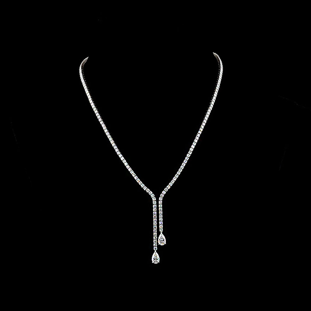 Lab Grown Pear and Round Brilliant cut diamond lariat tennis necklace.

10.50cts total weight, 191 diamonds

E/F VVS-VS1

14K White Gold