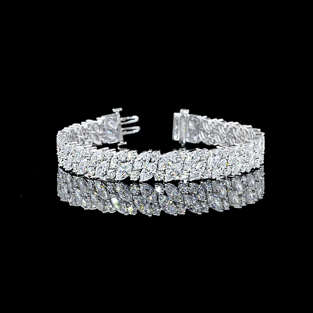 Lab Grown Marquise and Round Brilliant cut diamond tennis bracelet.

19.75cts total weight, 100 Diamonds

E/F VVS-VS1

7" long

14K White Gold