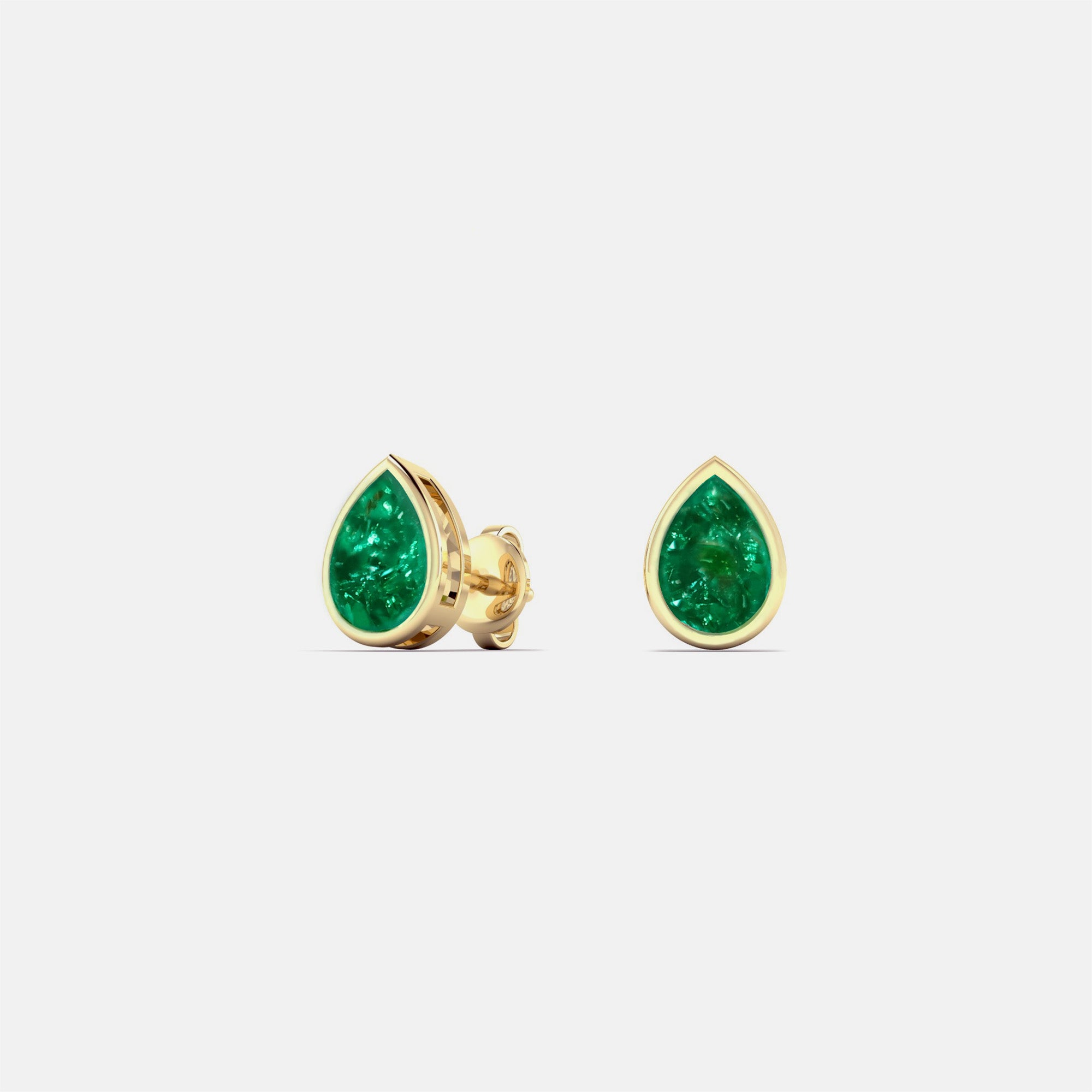 emerald studs in gold setting