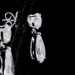 Pear cut and round brilliant cut diamond earrings handcrafted in 14k white gold 5 ct total